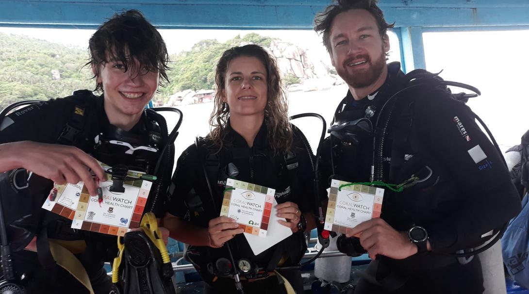 A team of diver conservationists on a boat in Thailand