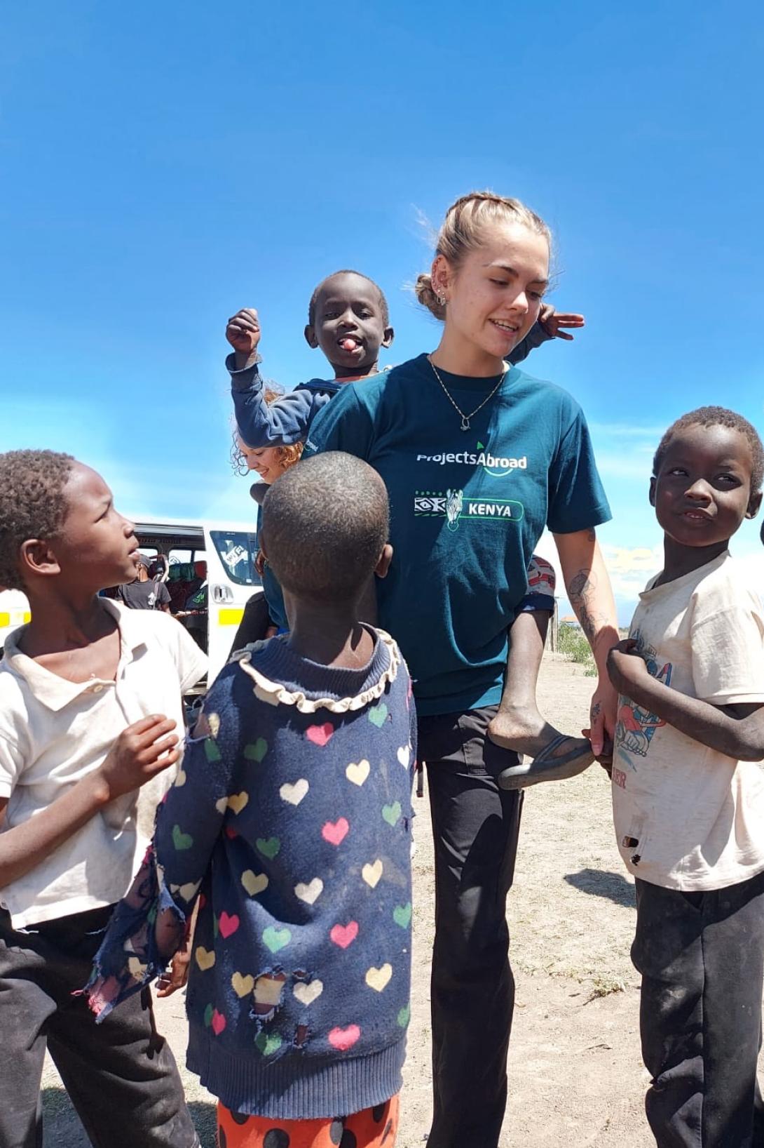Medical volunteer with children in Kenya