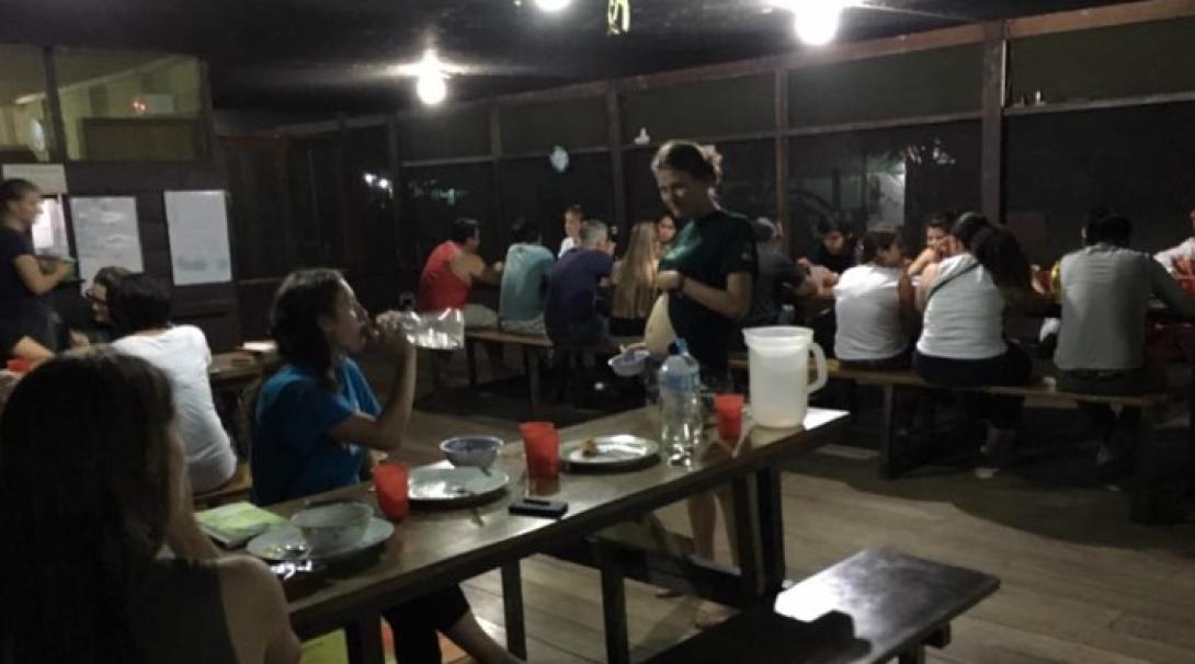 Volunteers eating in the dining room at Taricaya