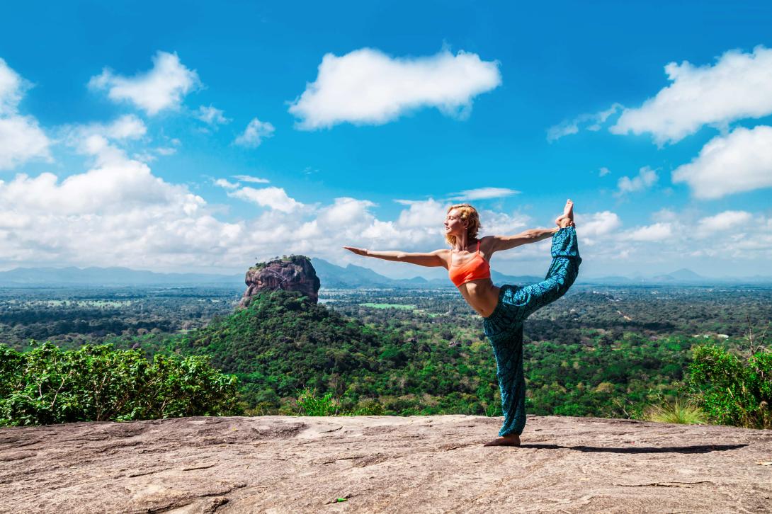 Girl practices yoga in the mountains of Sri Lanka