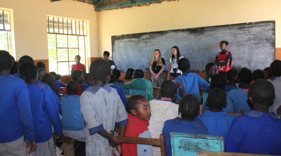 Volunteers in Kenya lead a health presentation