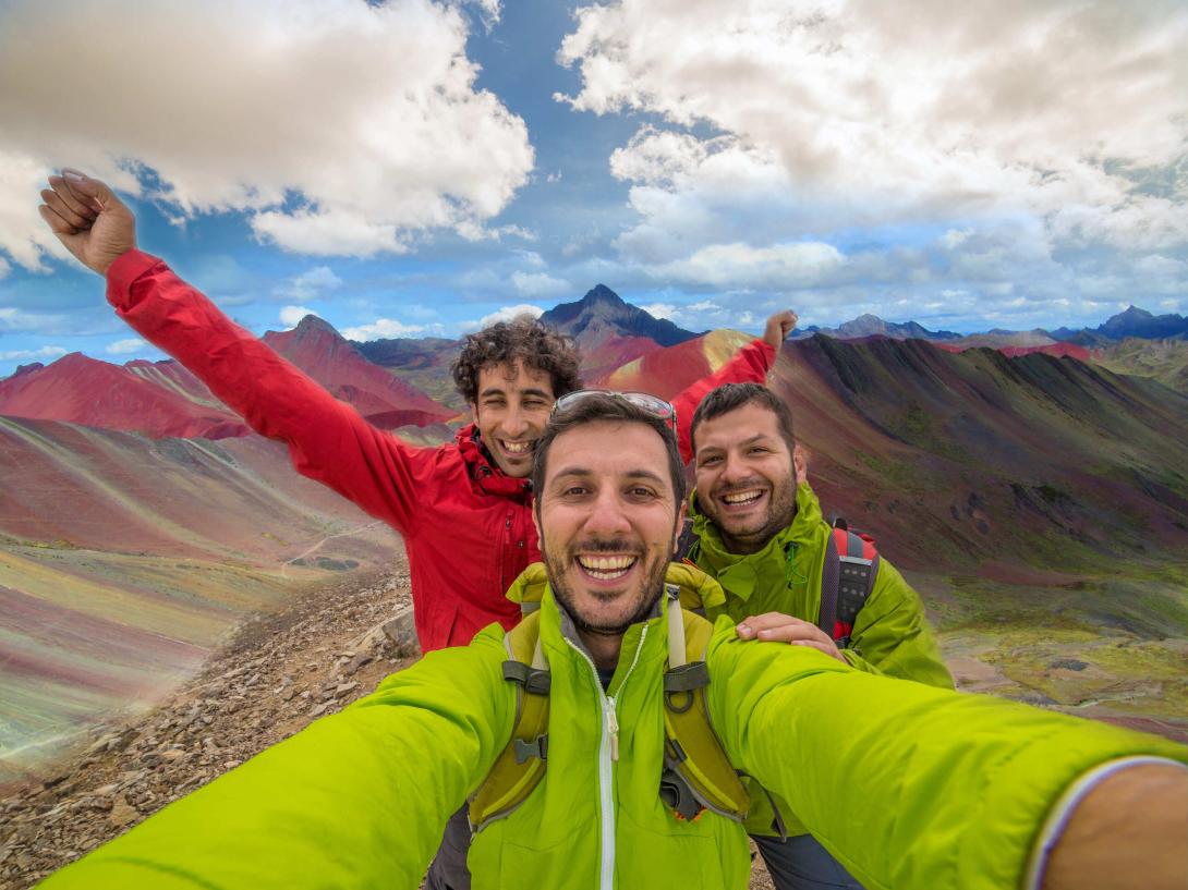 Travellers explore the Rainbow Mountains in Peru.