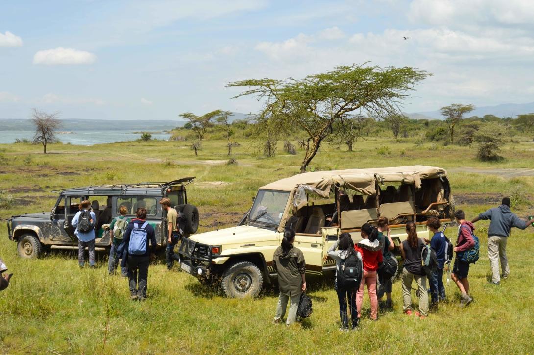 Volunteers get into their vehicles after working in Soysambu conservancy.