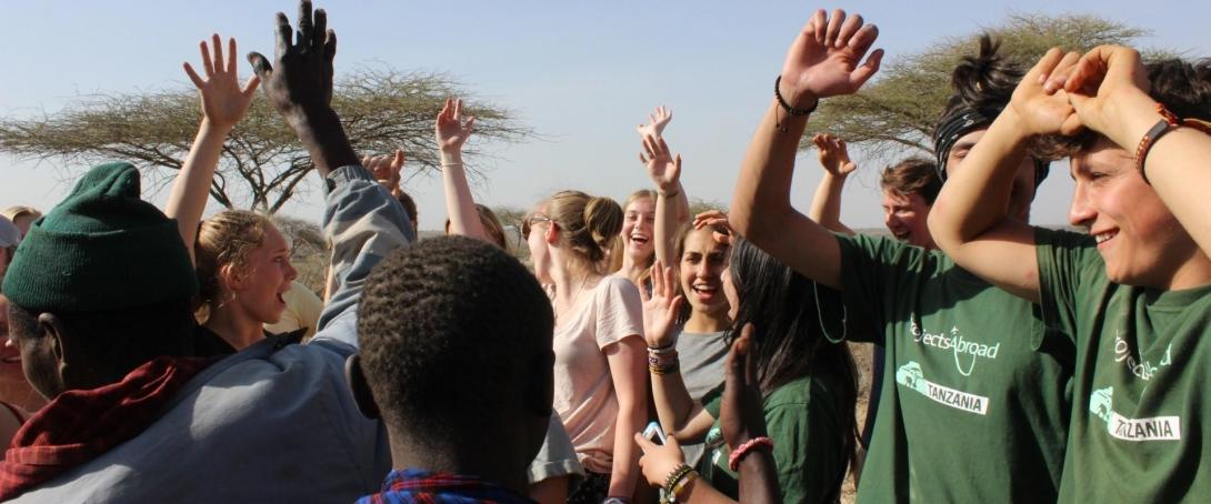 Volunteers dance with Maasai