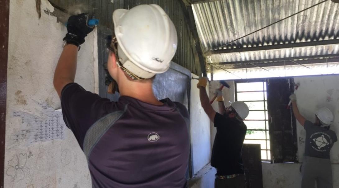 Volunteers prepare a classroom for a rebuild