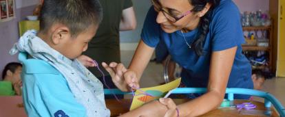 An Occupational Therapy intern gains work experience by helping treat a disabled child in Cambodia.