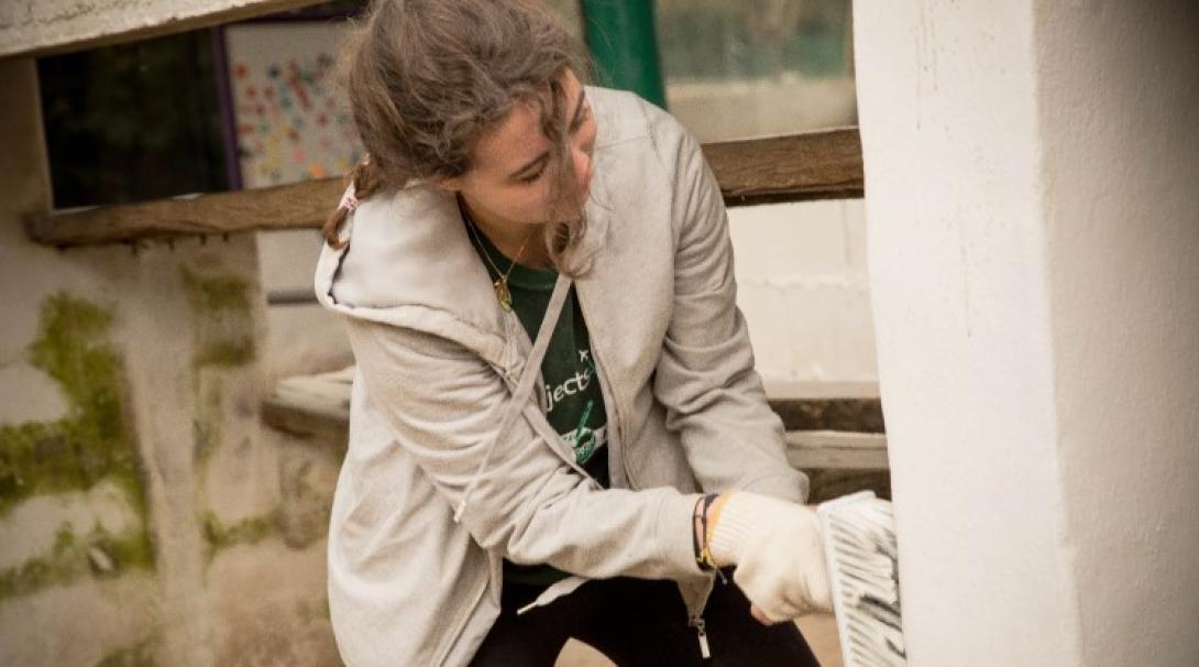 Volunteer repairing a shelter