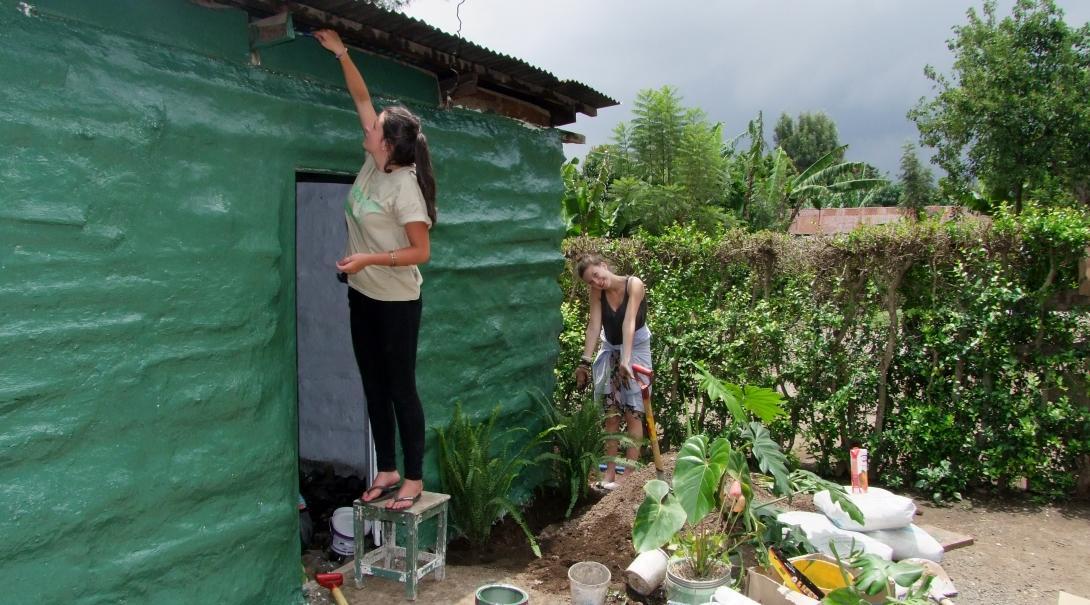 Seen here is a female Projects Abroad volunteer assisting with building a home for a local family during her building volunteer work in Tanzania