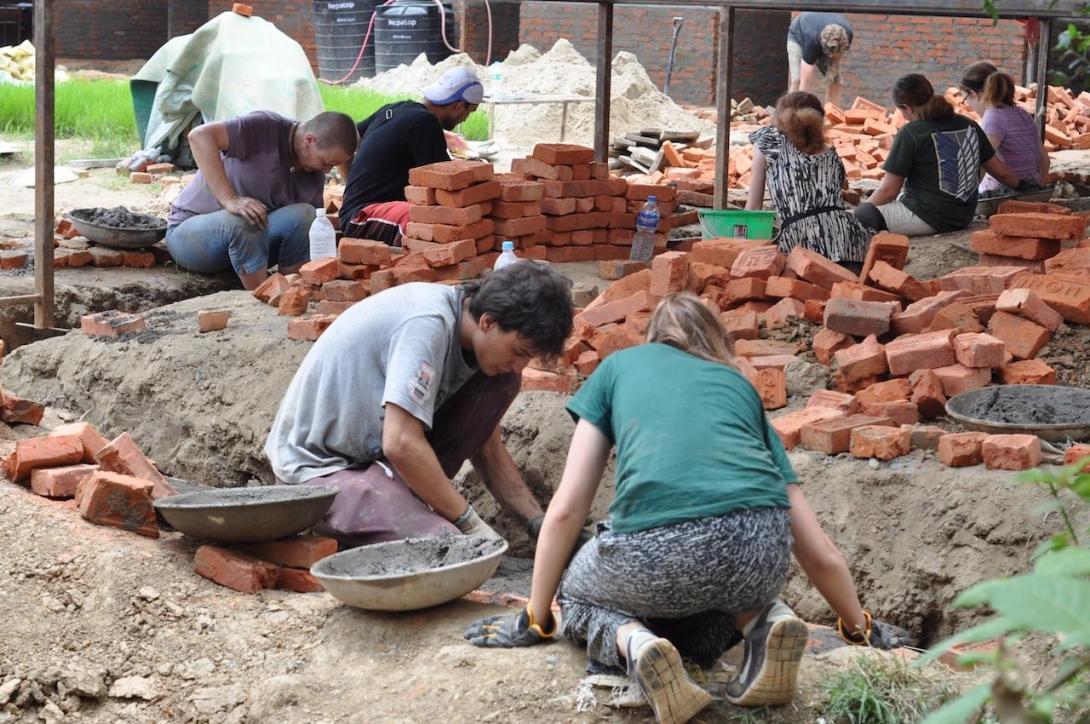 Volunteers with Projects Abroad help to build classrooms during their building volunteer work in Nepal.