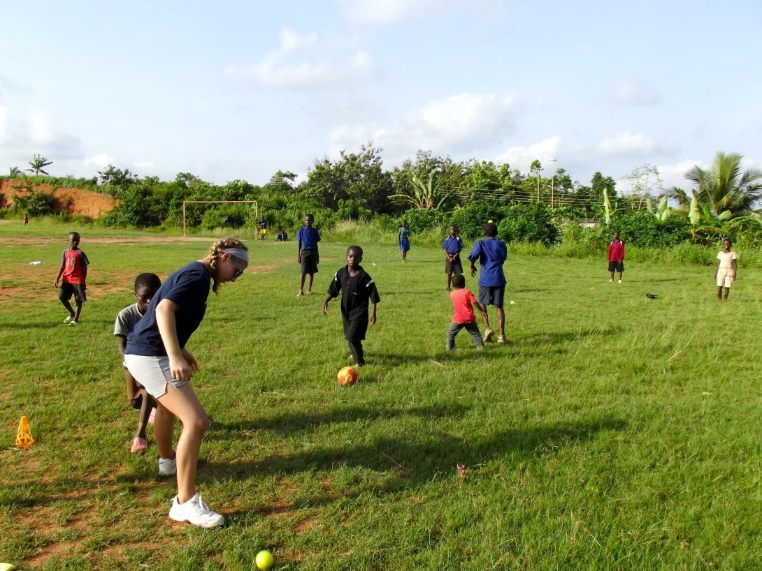 Projects Abroad volunteers taking part in football coaching for high school students in Ghana help improve the skills of their students.   