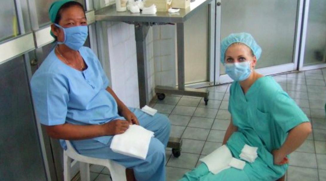 Female Projects Abroad medical intern sitting with a healthcare staff member in Cambodia