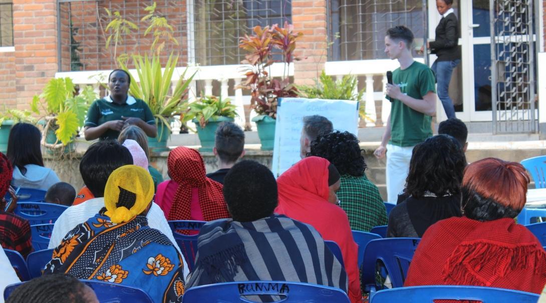 Interns give a presentation to a group of women business owners and gain micro-finance work experience in Tanzania.