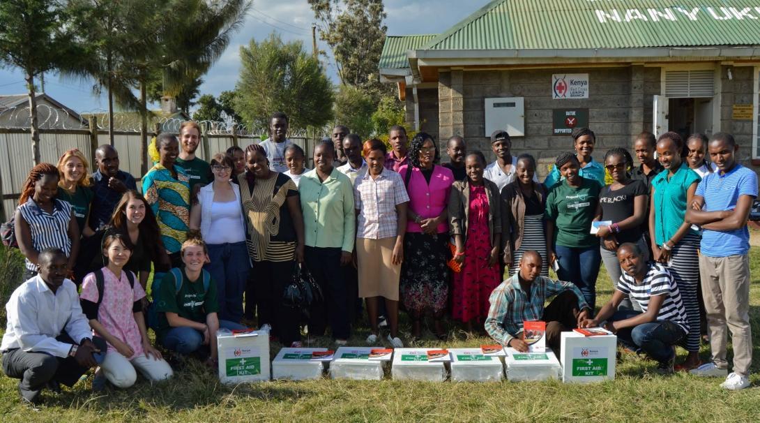 High school students and local staff donate first aid kits on our medical internship in Kenya