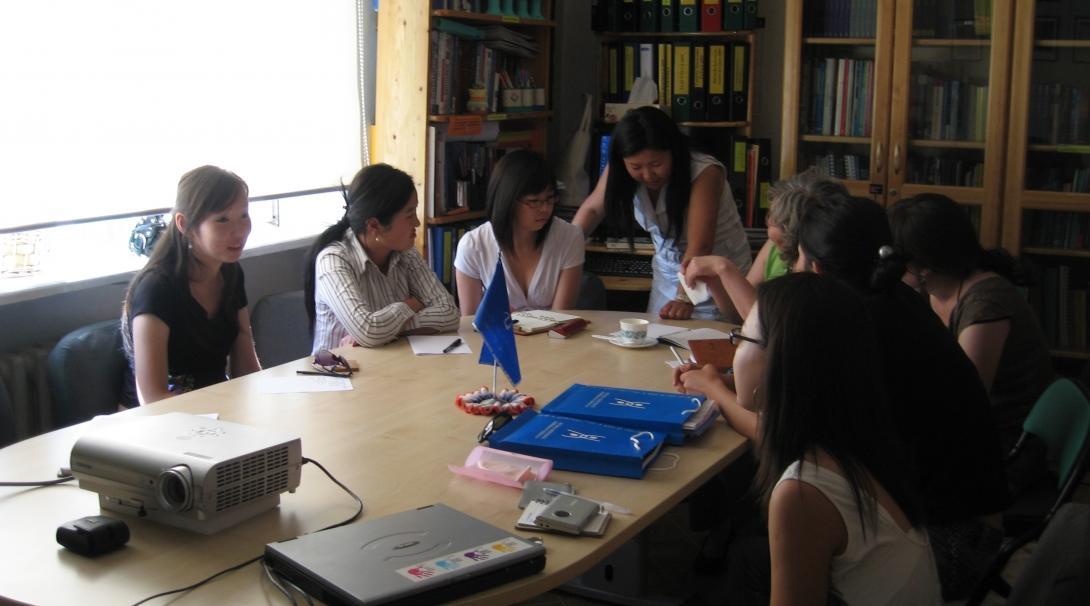 Students join staff in a meeting during their Law internships in Mongolia.