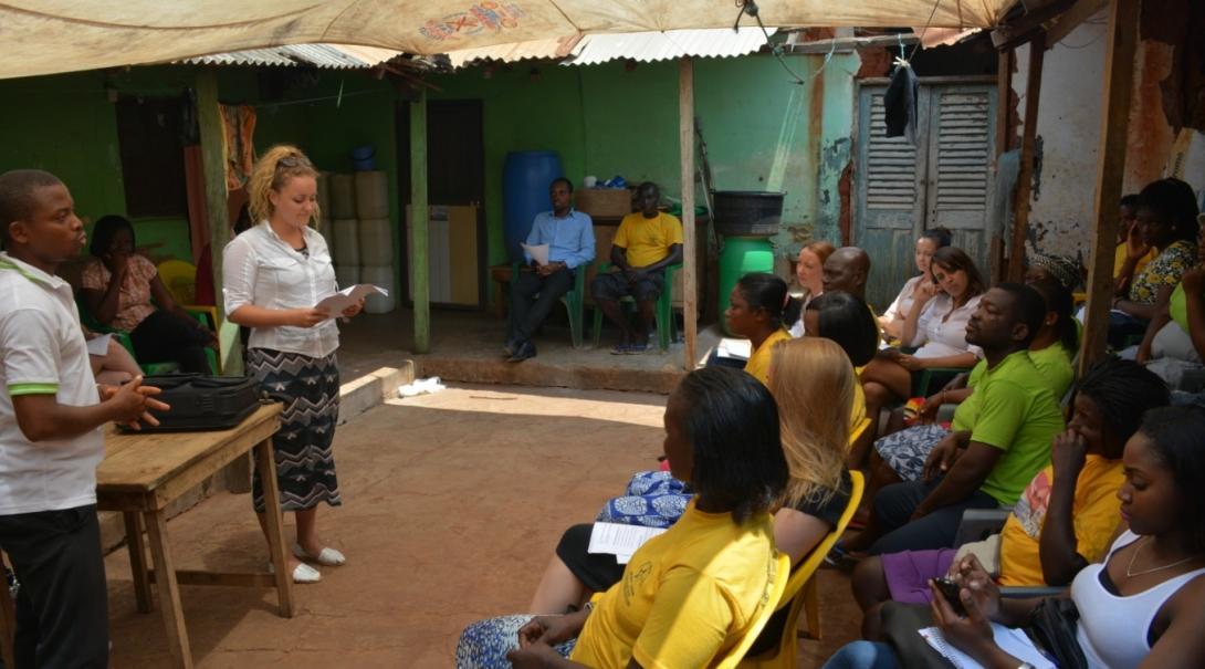 Projects Abroad representatives address a community on police brutality on their Human Rights internships in Ghana.