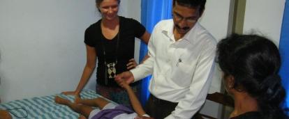 A Projects Abroad intern is pictured watching over a doctor as part of their physiotherapy internship in Sri Lanka.