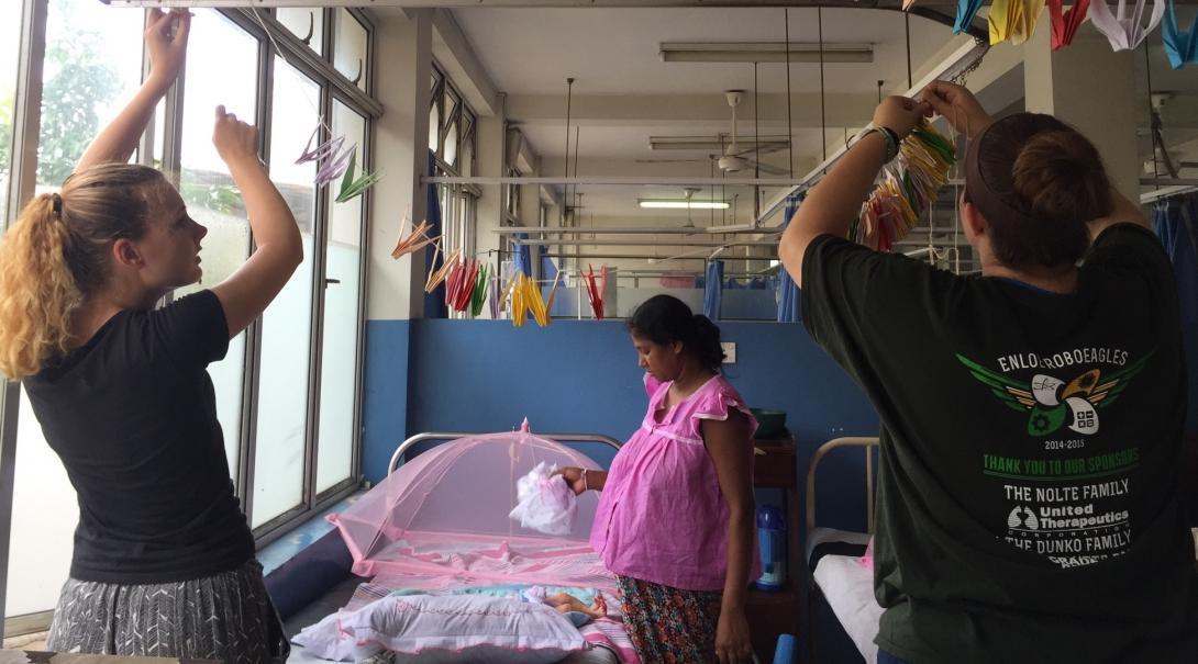 A group of interns from Projects Abroad are seen decorating the childrens room at a local hospital whilst on their midwifery internships in Sri Lanka.