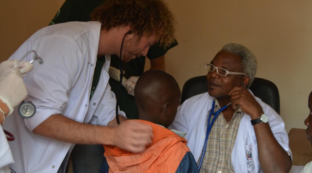 A doctor demonstrates measuring heart rate on our medical internship for teenagers in Tanzania