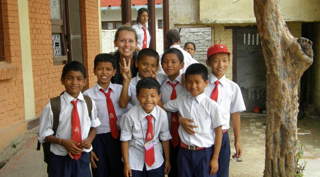 A group photo of a Projects Abroad volunteer with her students at her volunteer teaching placement in Nepal