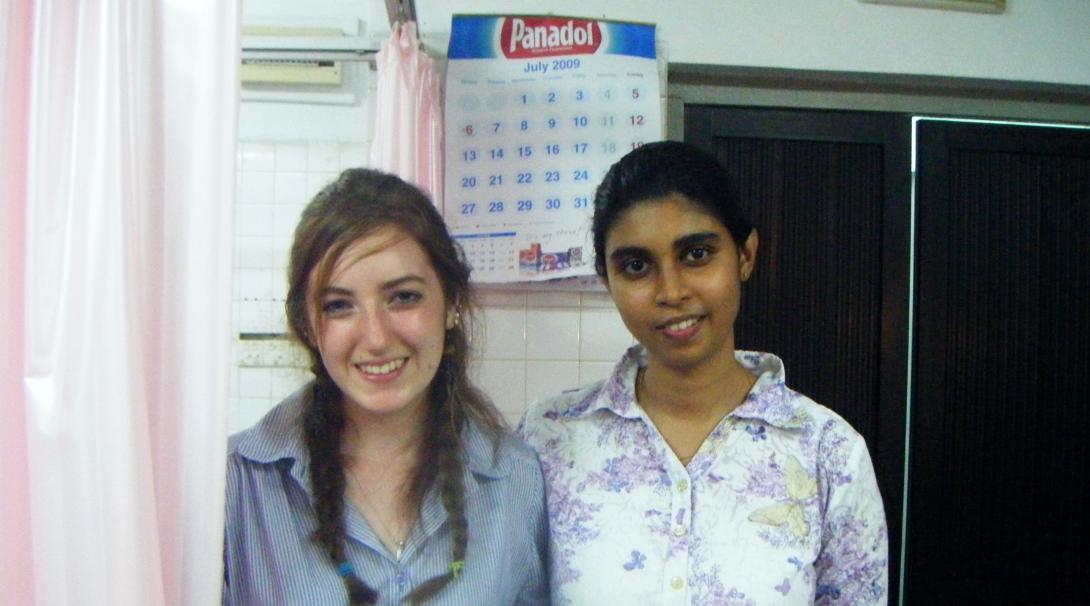 Female Dentistry intern poses with a Healthcare staff member in Hospital during a Dentistry internship placement in Sri Lanka.