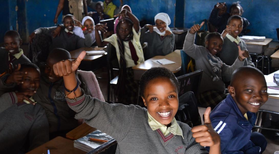 A student shares a thumbs up at one of our volunteer teaching placements in Kenya
