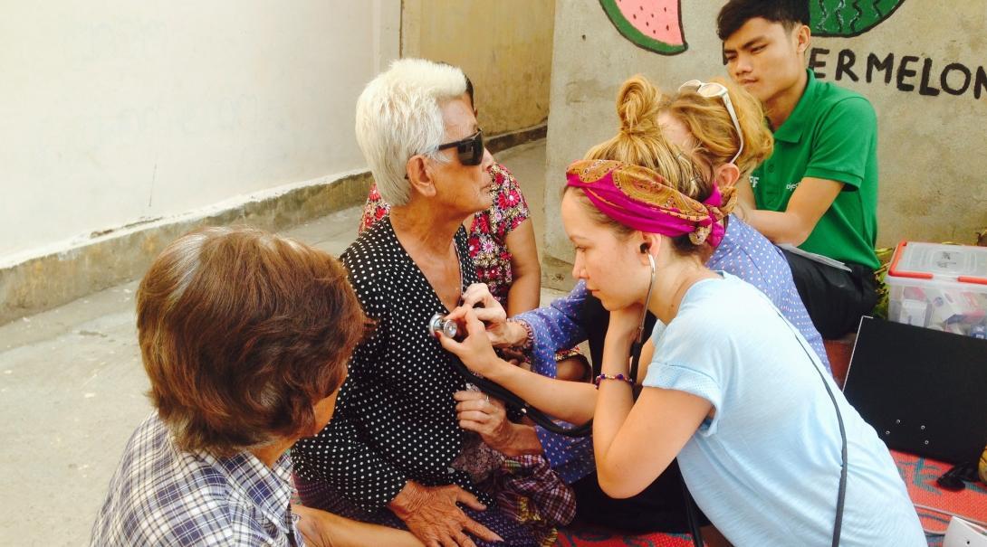  Interns learn how to check the vital signs of a patient as part of Public Health work for teenagers in Cambodia. 