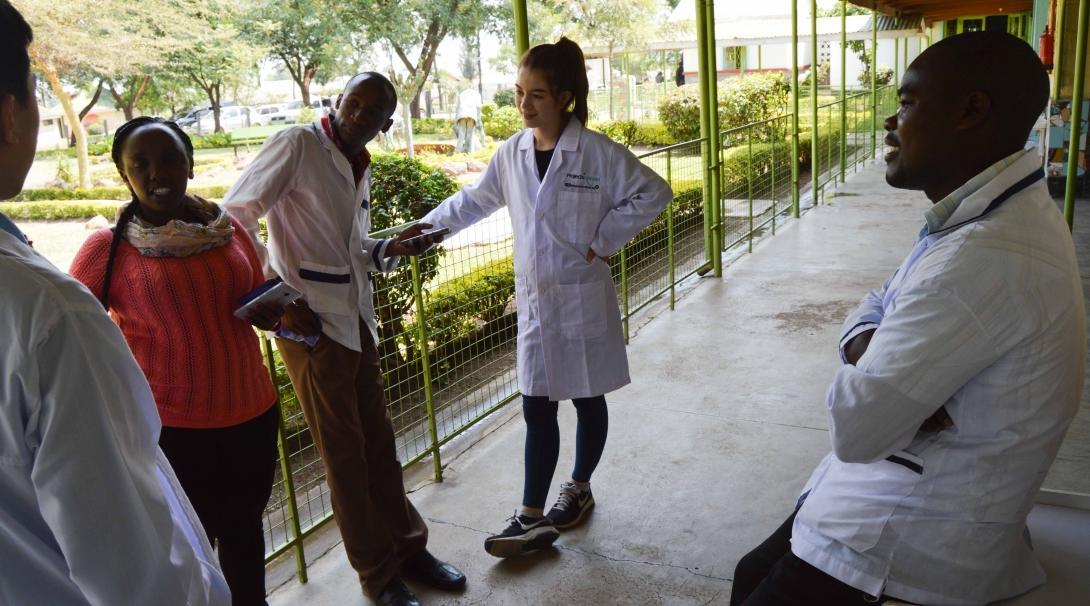 Projects Abroad occupational therapy in Kenya interns are pictured conversing with local doctors outside the hospital during their work experience.