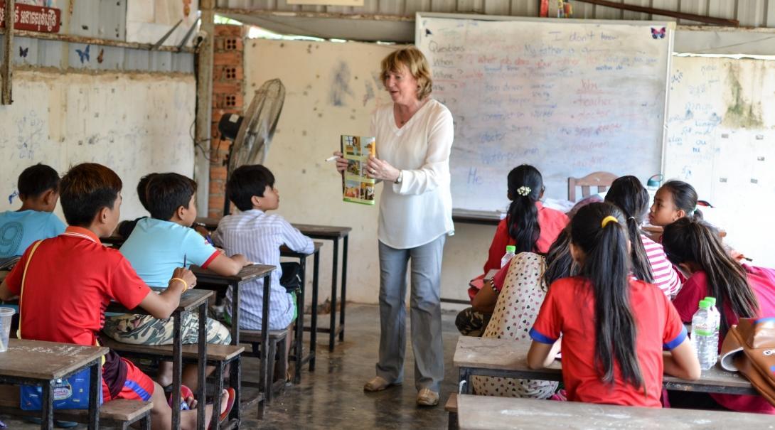 An English book is read to the students by a Projects Abroad volunteer teaching in Cambodia 