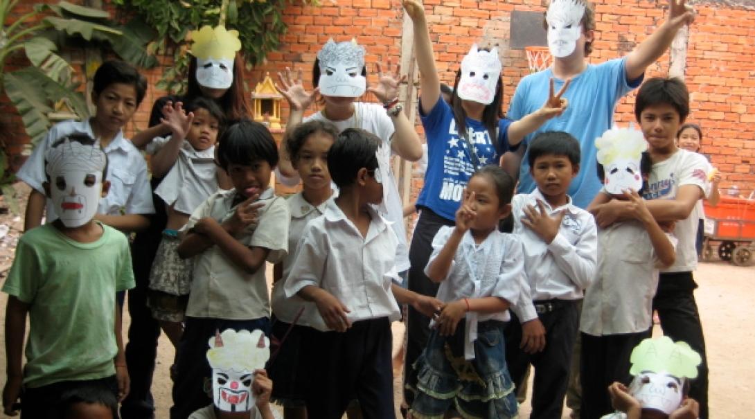 Students pose with their handmade masks at one of our teaching placements in Cambodia