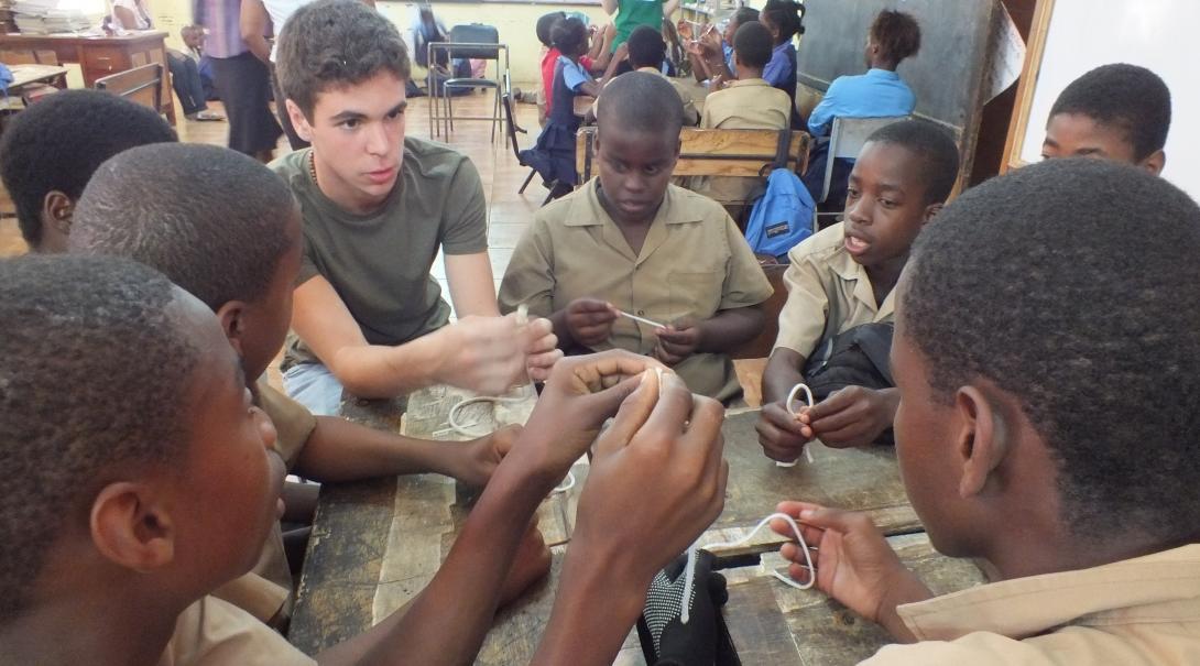A Projects Abroad volunteer teaching life skills to a group of boys at his volunteer teaching placement in Jamaica