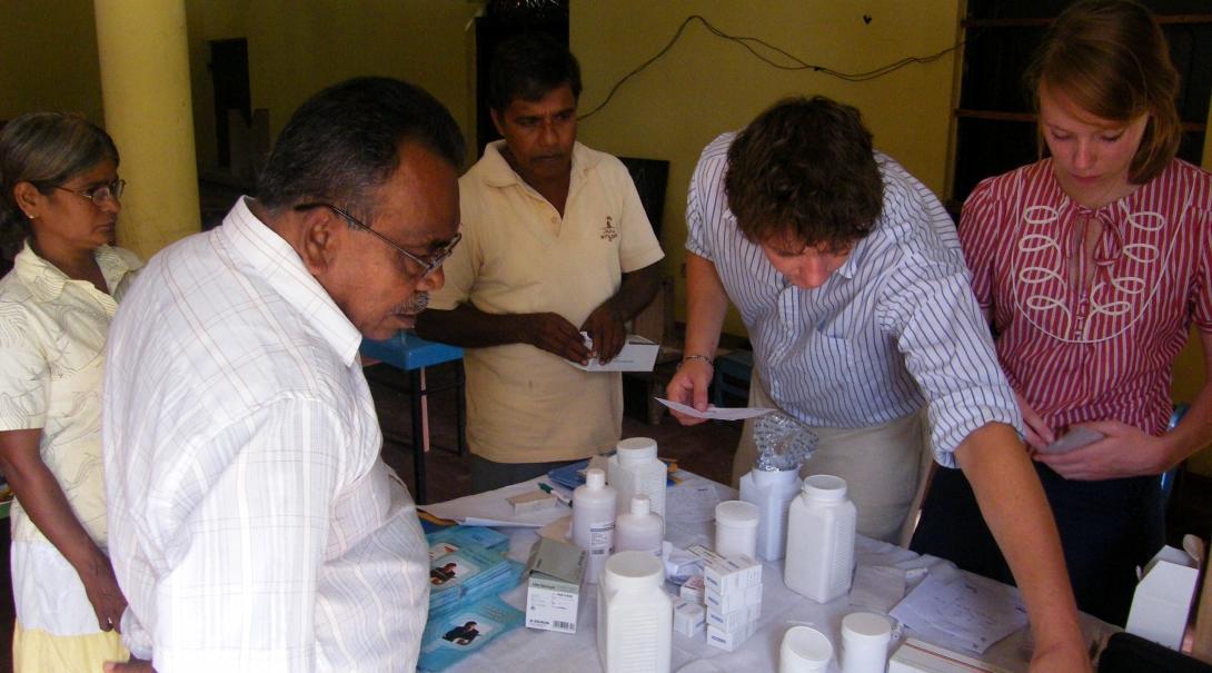Interns and doctors are seen handing out prescriptions to local residents as part of their pharmacy internship in Sri Lanka.