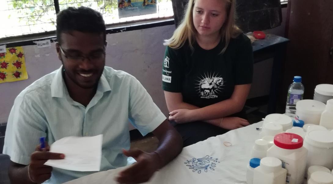 Interns from Projects Abroad helping doctors with medicine prescriptions as part of their pharmacy internship in Sri Lanka.
