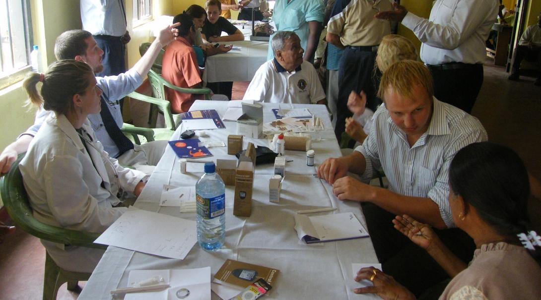 Projects Abroad interns and local doctors going over their notes at the hospital during their pharmacy internship in Sri Lanka.