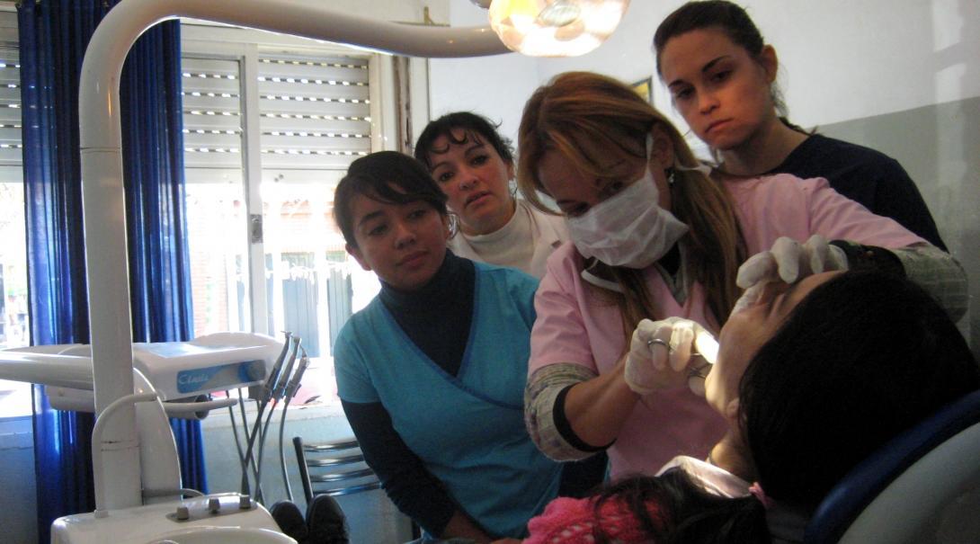 Projects Abroad Dentistry staff learn how to examine the patients mouth during Dentistry internships in Argentina.