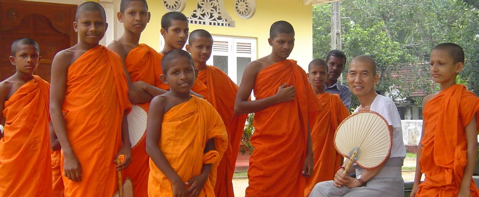 Young monks stand together near Sri Lanka volunteering opportunities with Projects Abroad.