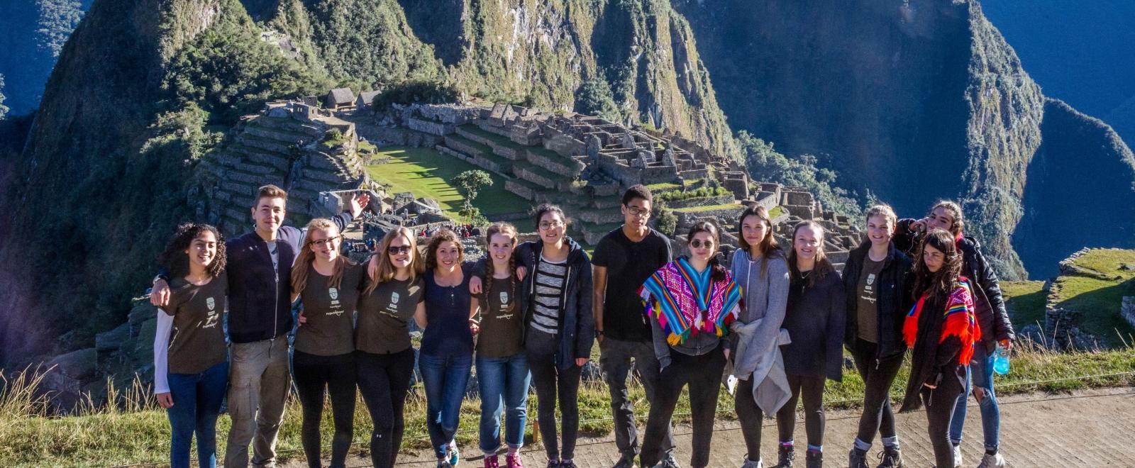 Teenage volunteers doing work with children in Peru, go on an organised weekend trip to Mach Picchu. 