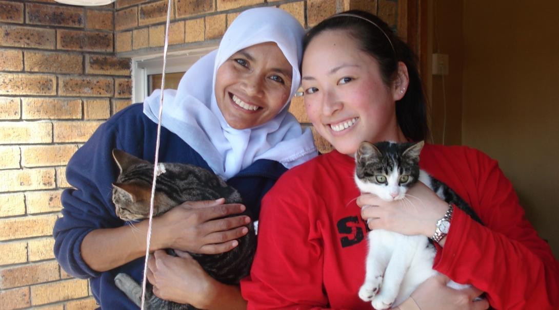 Cats being held and cared for by volunteers who work with animals in South Africa