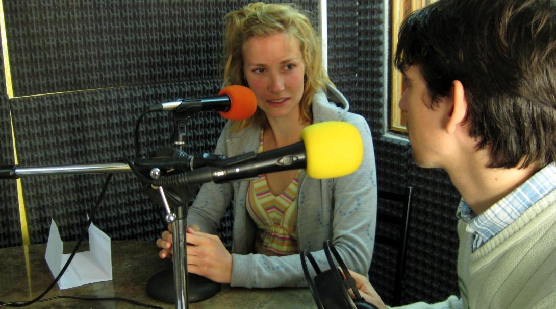 Two Projects Abroad interns practice interviewing each other at a radio station as part of their Journalism internship in Argentina. 