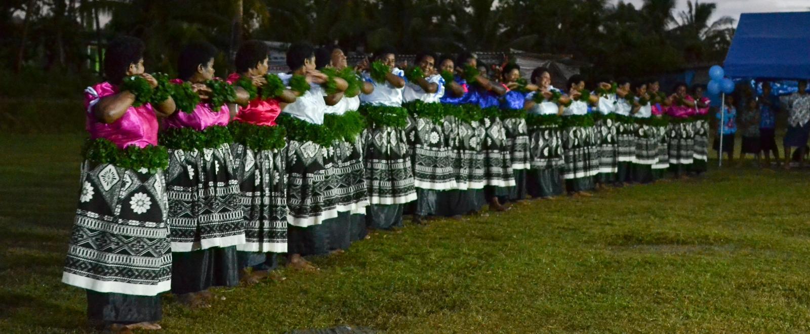 Local women in Fiji perform a ceremony for the opening of a Community Centre at a placement lead by Projects Abroad Staff. 