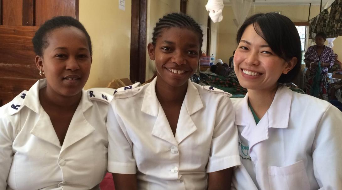 A student doing a Nursing internship abroad in Tanzania enjoys spending time with her local colleagues.