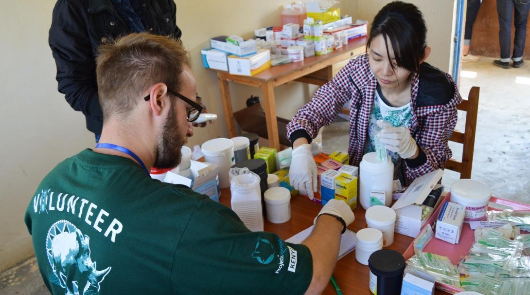 During a medical outreach in Kenya, pharmacy interns help local staff by preparing and sorting medication.