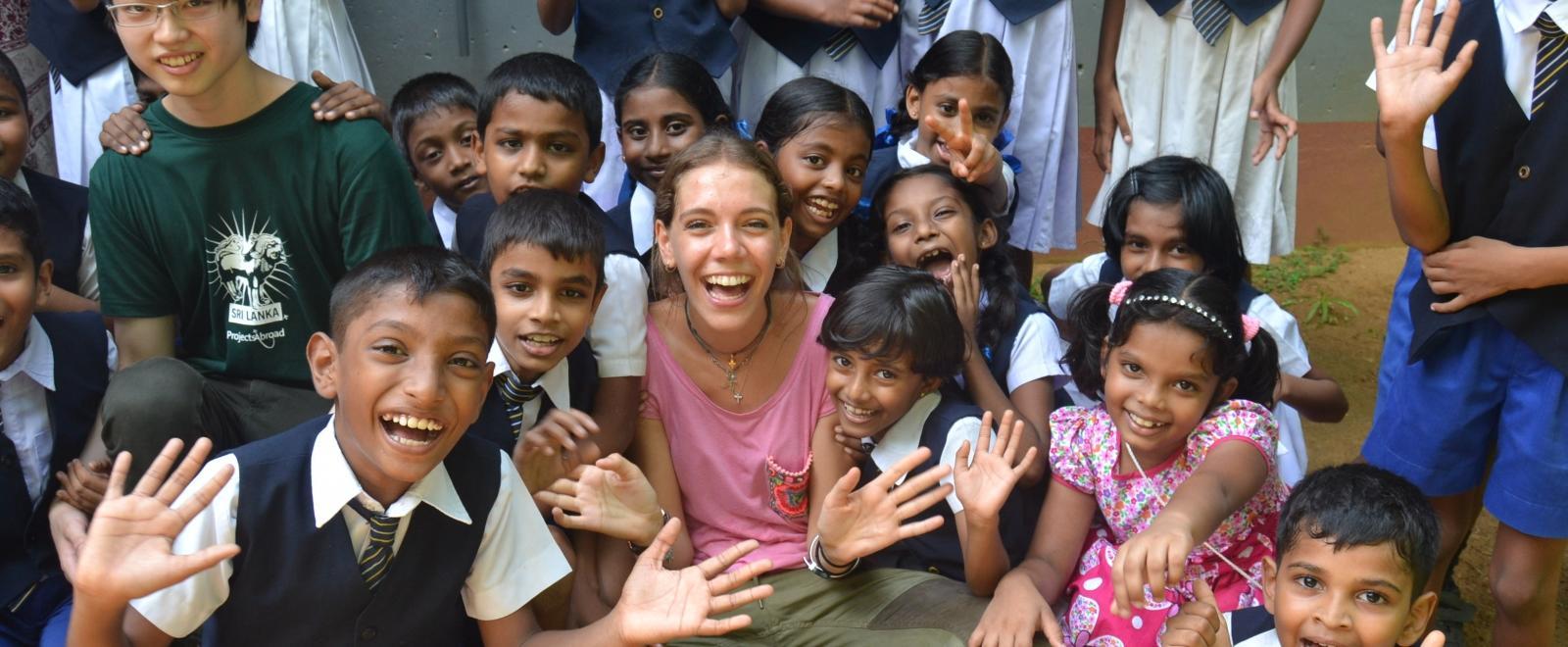 Two High School Special volunteers overseas for Christmas enjoy spending time teaching children in Sri Lanka. 