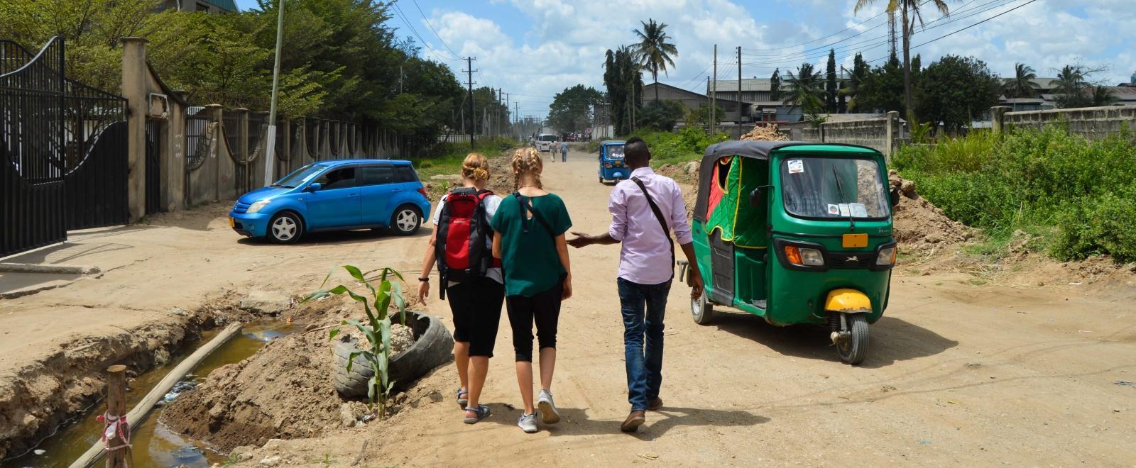 Volunteers follow a Projects Abroad staff member while learning how to navigate Tanzania.
