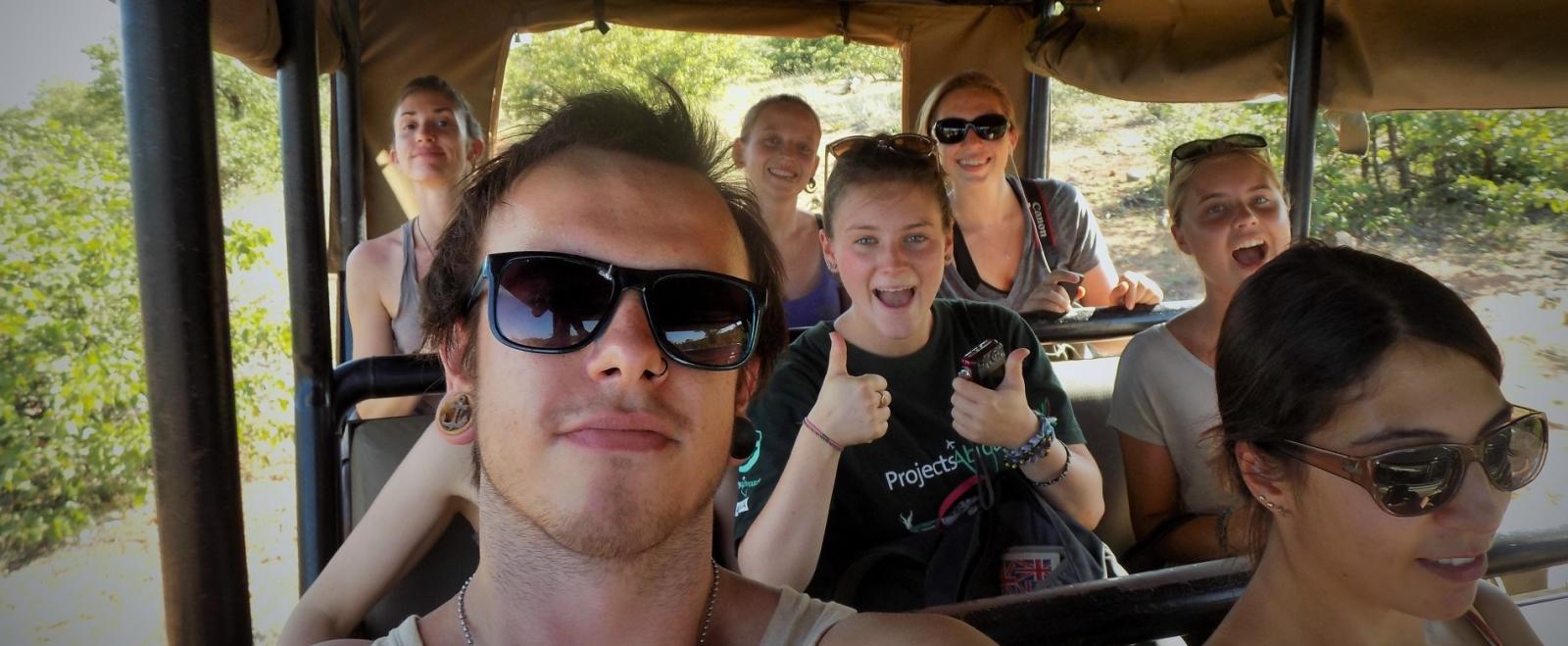 A safari vehicle tours the bushveld with the Projects Abroad volunteers in Botswana.