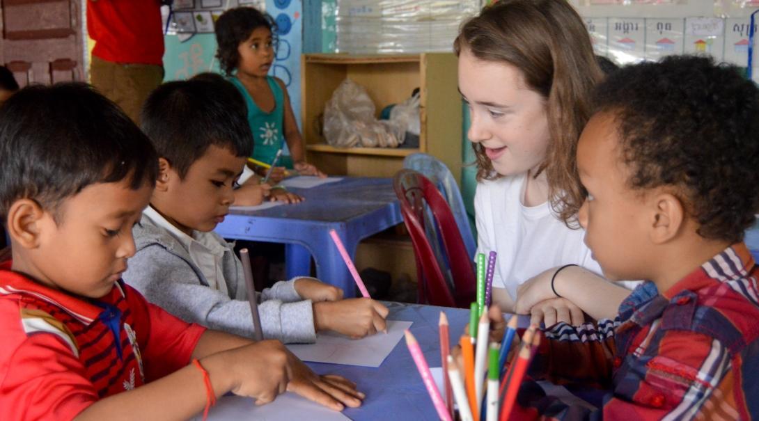 A Projects Abroad volunteer assists at a community-based care placement rather than orphanage volunteer work.