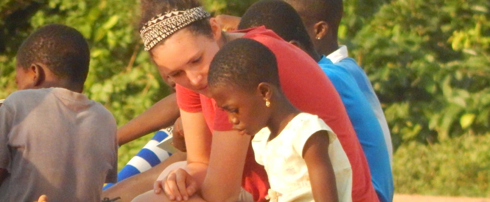 A Projects Abroad intern gains social work experience in Ghana by working through activities with a child. 