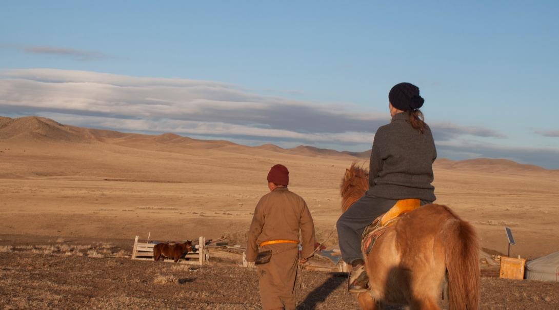 Nomads living on the Mongolian Steppe take care of their farm animals. 