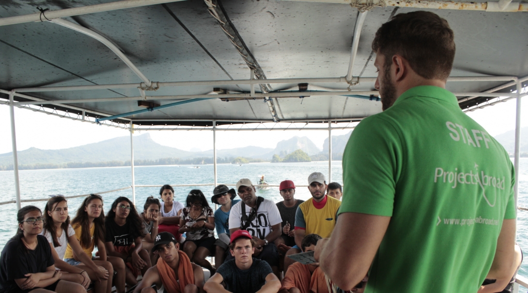 Conservation volunteers in Thailand listen to their project supervisor about staying safe while volunteering abroad.
