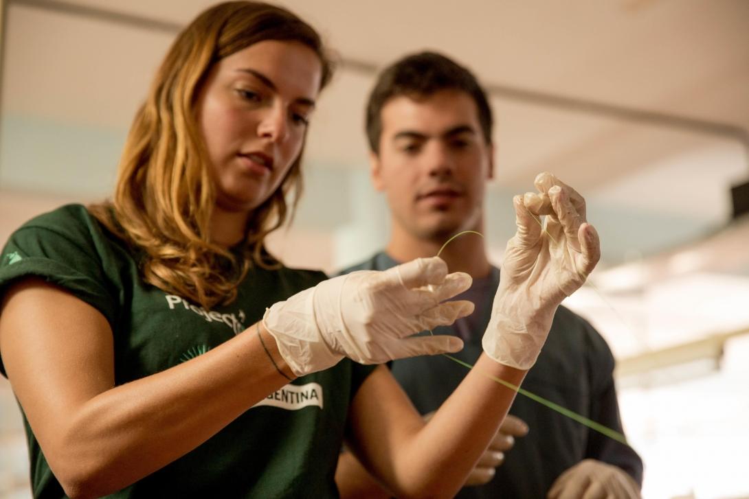A pre med student learns to suture during a medical workshop on an internship in Argentina.