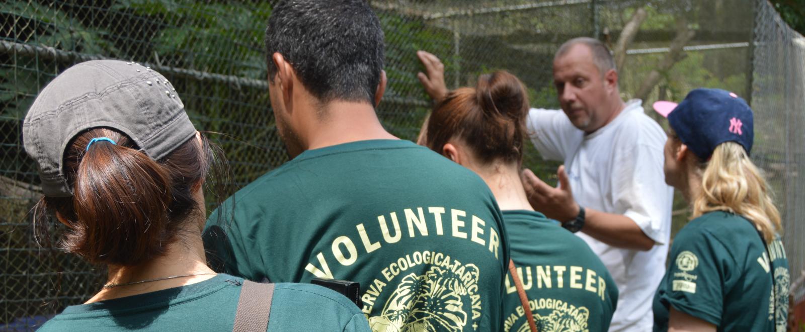 Stuart Timson take the Conservation volunteers on a tour of the animal rescue centre in Peru